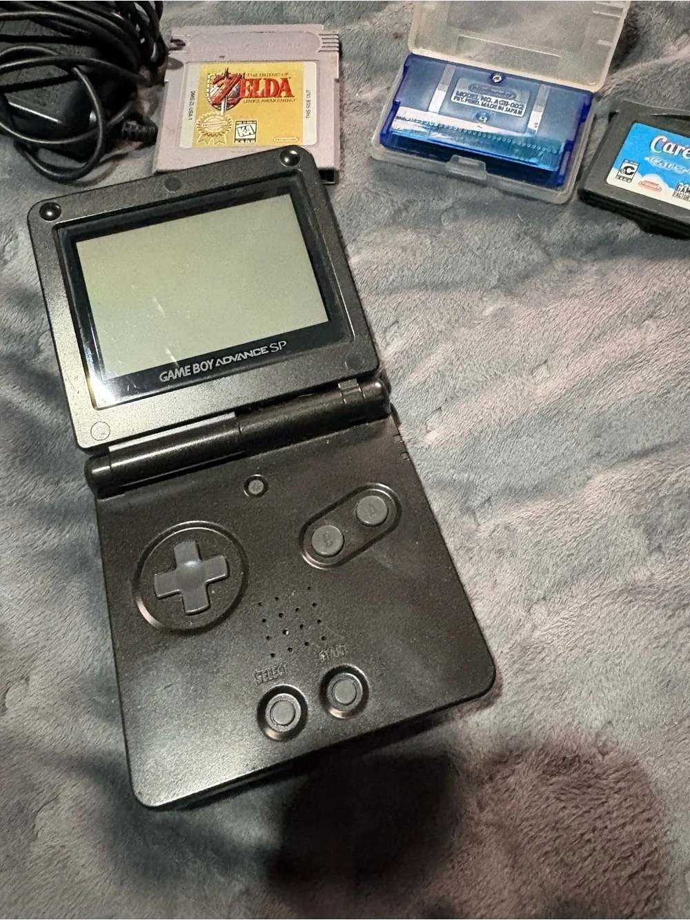 Nintendo Game Boy Advance SP Black with Pokémon sapphire, Zelda, Care Bears